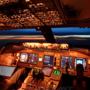 Airplane Cockpit Internal Night View With Pilot